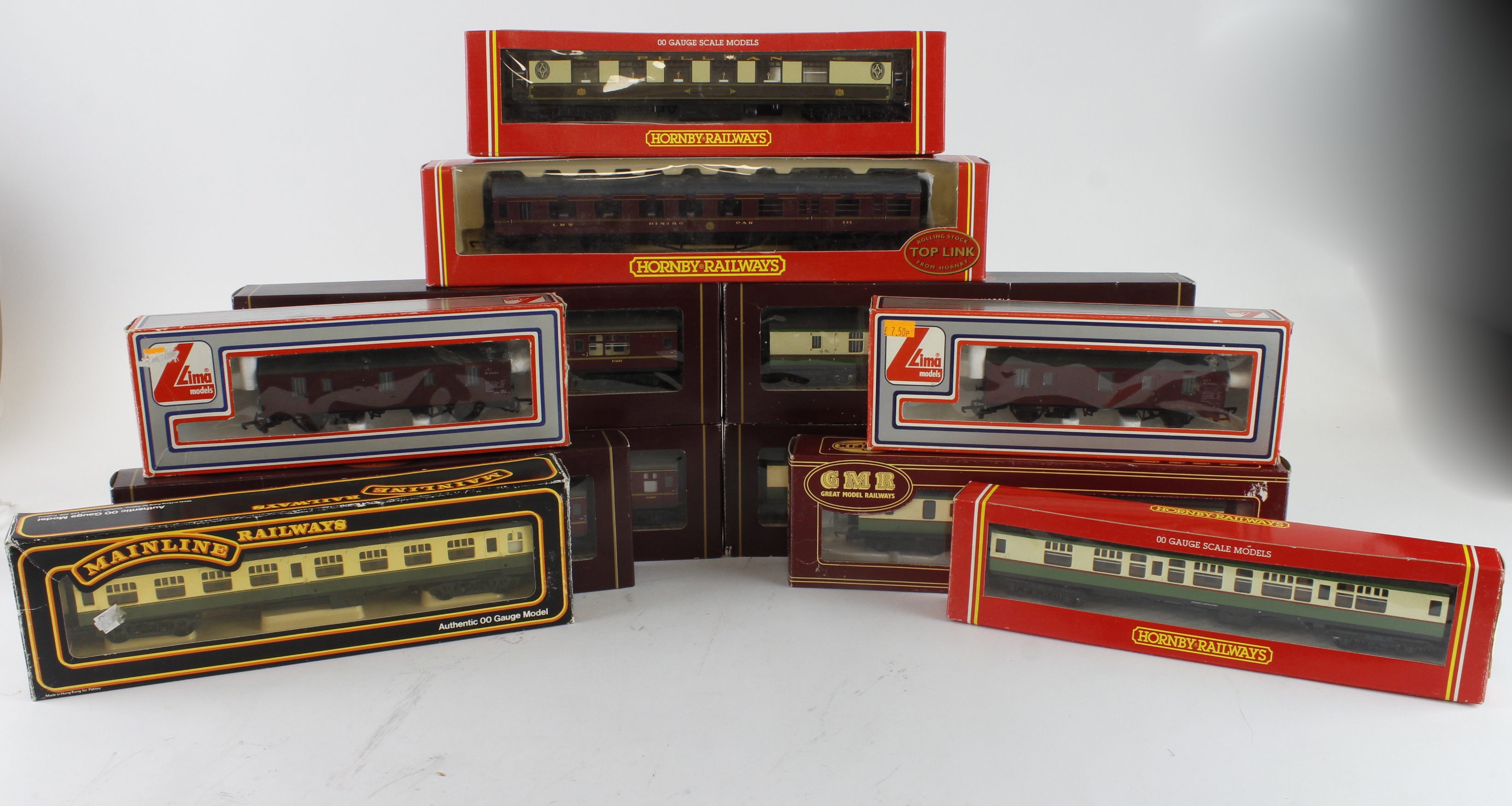 Coaches. Twelve boxed OO gauge coaches, makers include Hornby, Lima, Mainline & Airfix