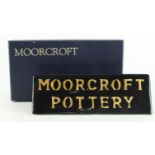 Moorcroft name plaque, makers marks to base, length 18.5cm approx., contained in a Moorcroft box