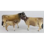 Beswick. Three Beswick figures, comprising Jersey Bull (Dunsley Cowboy), Cow (Newton Tinkle) & Calf,