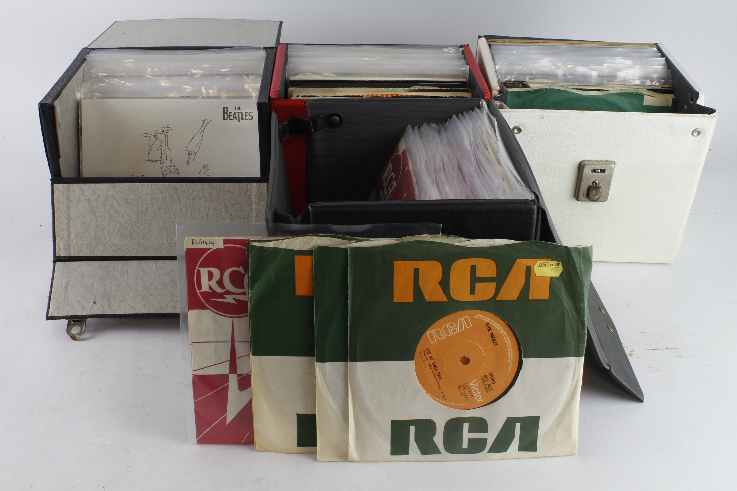 Records. Four cases of 45 single records, artists include Beatles, Elvis Presley, Rolling Stones,