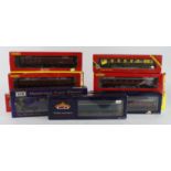 OO gauge. Nine boxed OO gauge rolling stock (mostly coaches), makers comprise Hornby, Bachmann &
