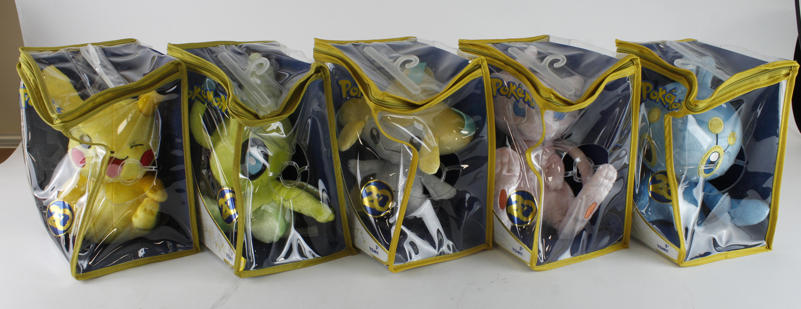 Pokemon. Five Pokemon 20th Anniversary collectible plush toys by Tomy, comprising Pikachu, Mew,