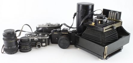 Photography related. A group of cameras and lenses, including plate camera with Schneider