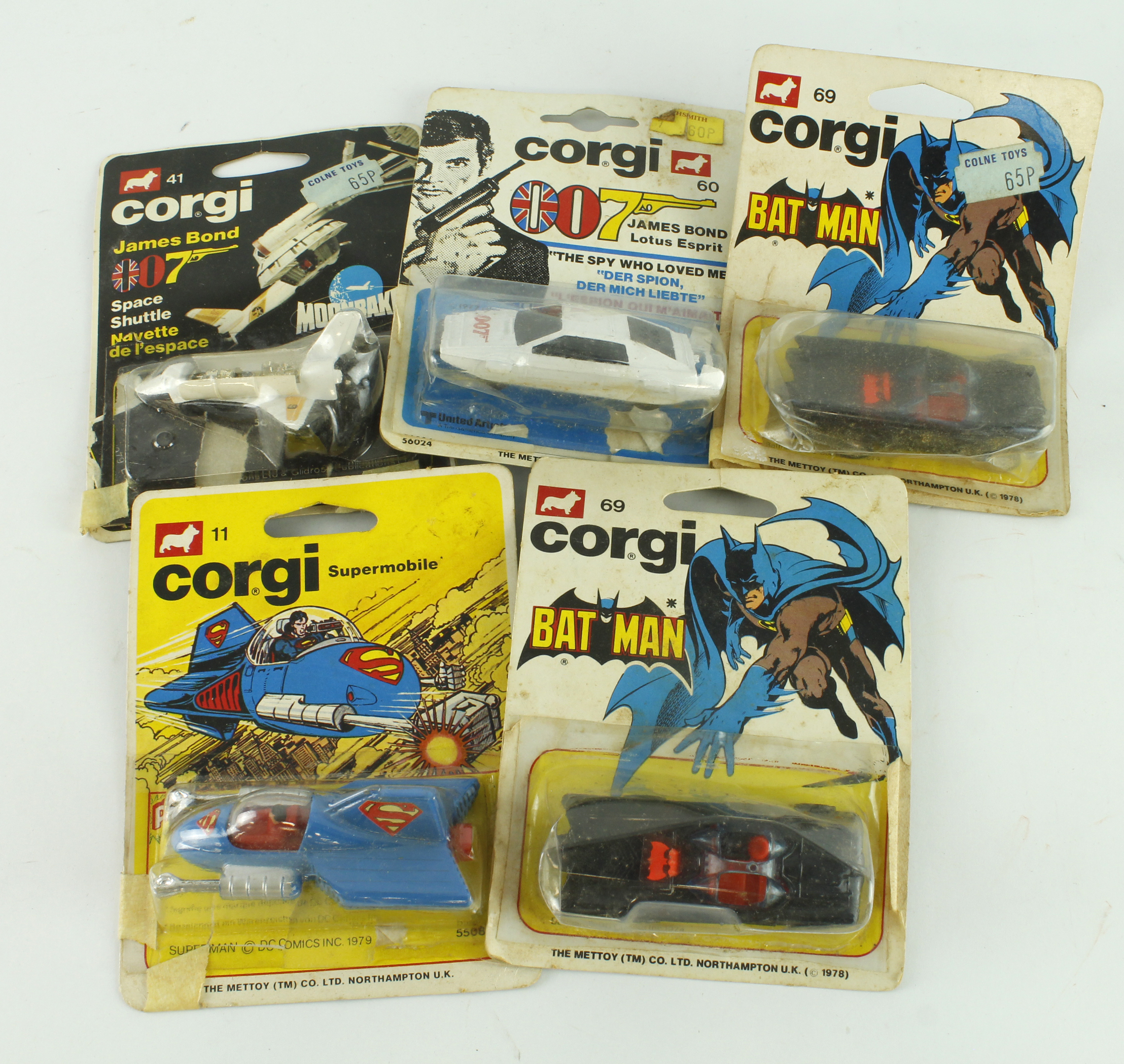 Corgi. Five Corgi Mettoy models, comprising Batman Batmobile (no. 69, x2); Superman Supermobile (