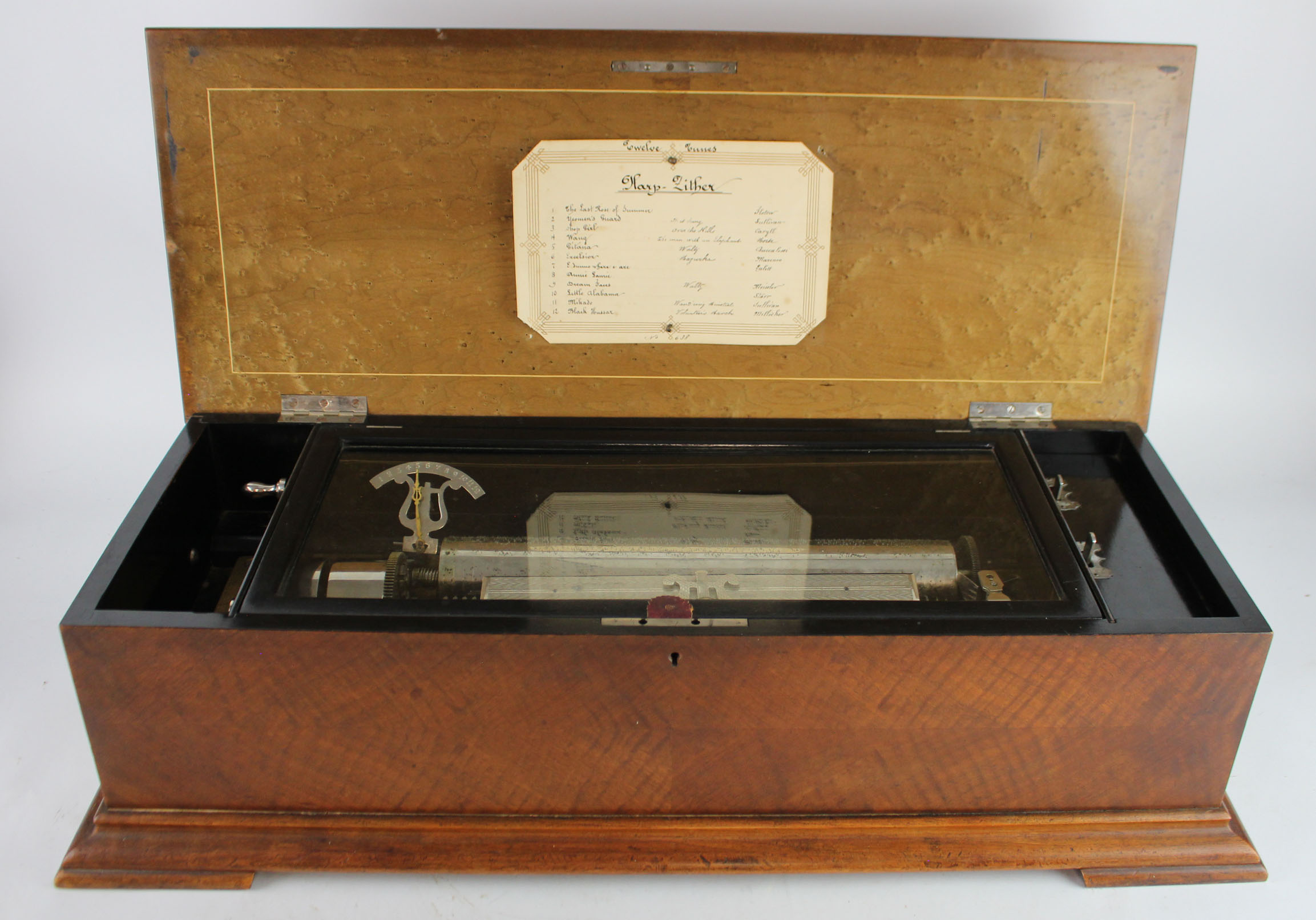 Music Box. Large cased (possibly American Maple) music box (no. 638), circa late Victorian,