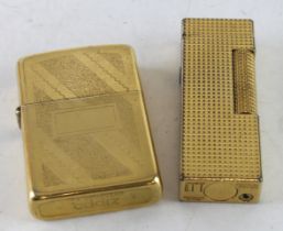 Lighters. Two gold plated lighters, comprising a Zippo & Dunhill