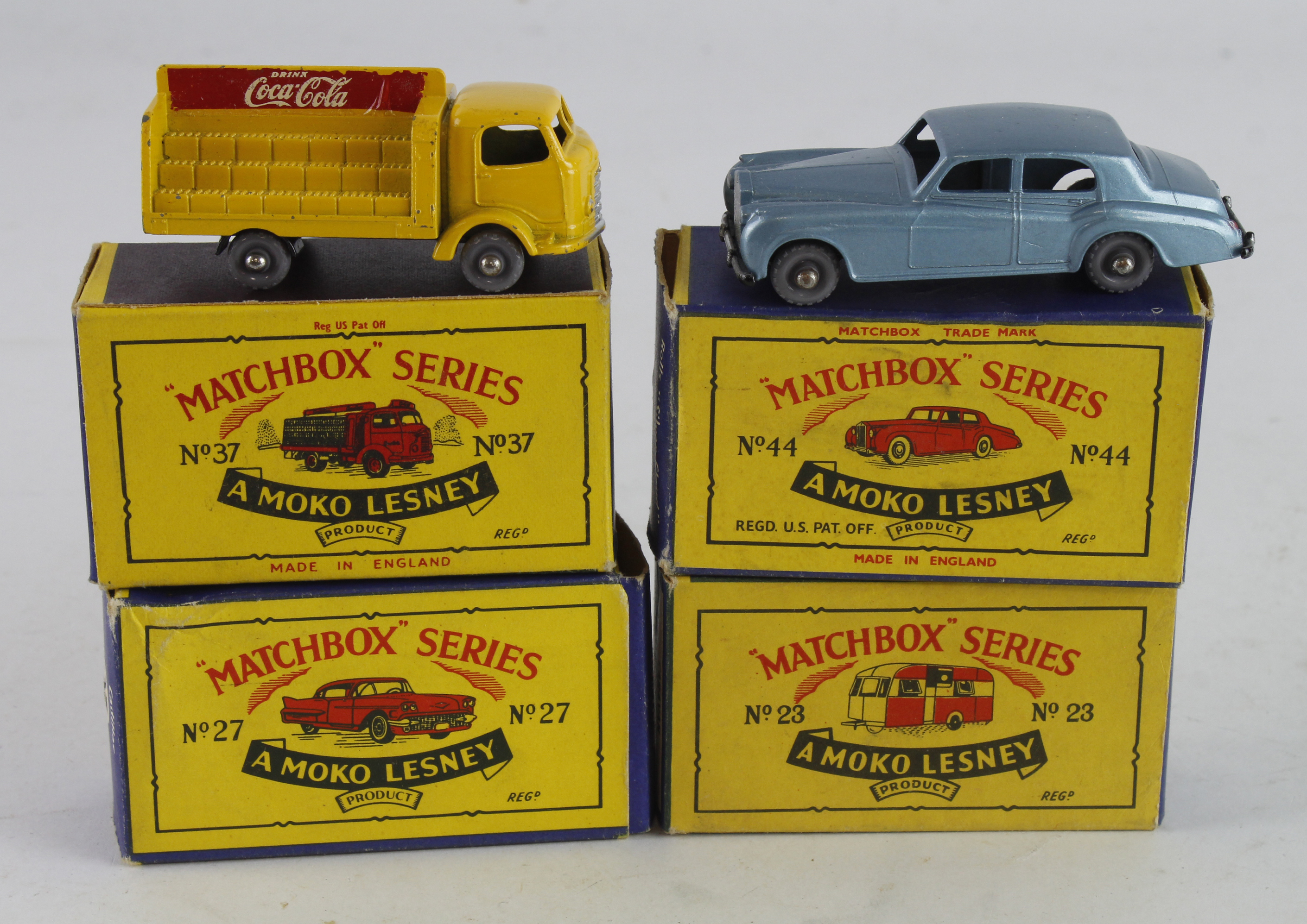 Matchbox. Four boxed Matchbox Moko Lesney models, comprising Caravan (no. 23); Cadillac (27); Coca