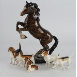 Beswick. Six Beswick figures, comprising Rearing Horse (1014) & five hounds tallest 26cm approx.