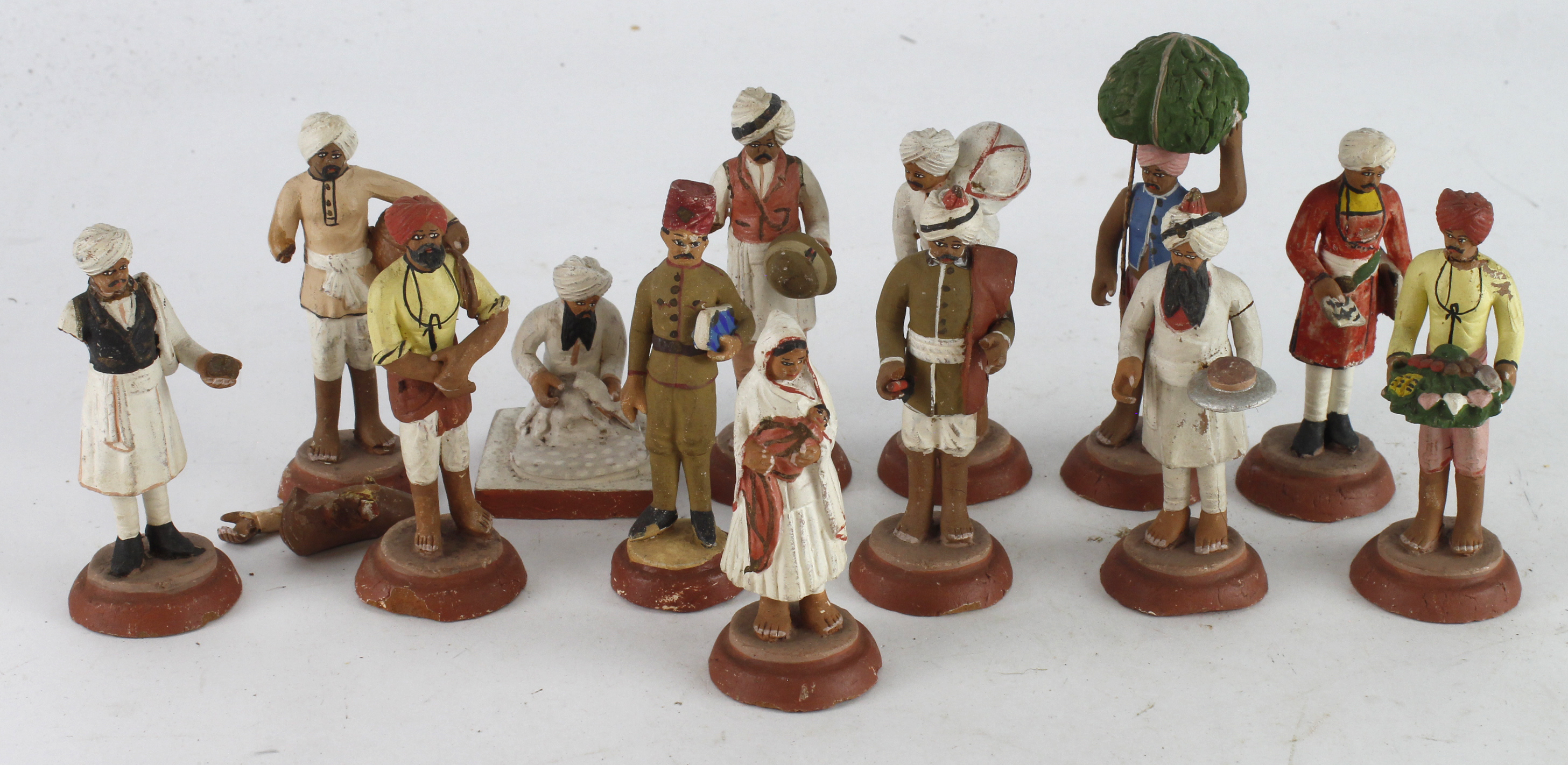 Figures. A group of clay figures thought to of been brought back by a serviceman during WWI,