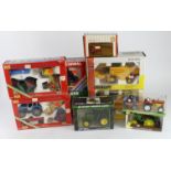Diecast. A collection of ten boxed mostly diecast farm vehicles, including tractors and combine