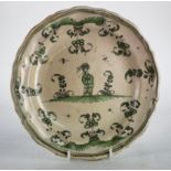 French Faience green & white plate, with figural decoration, diameter 24cm approx.