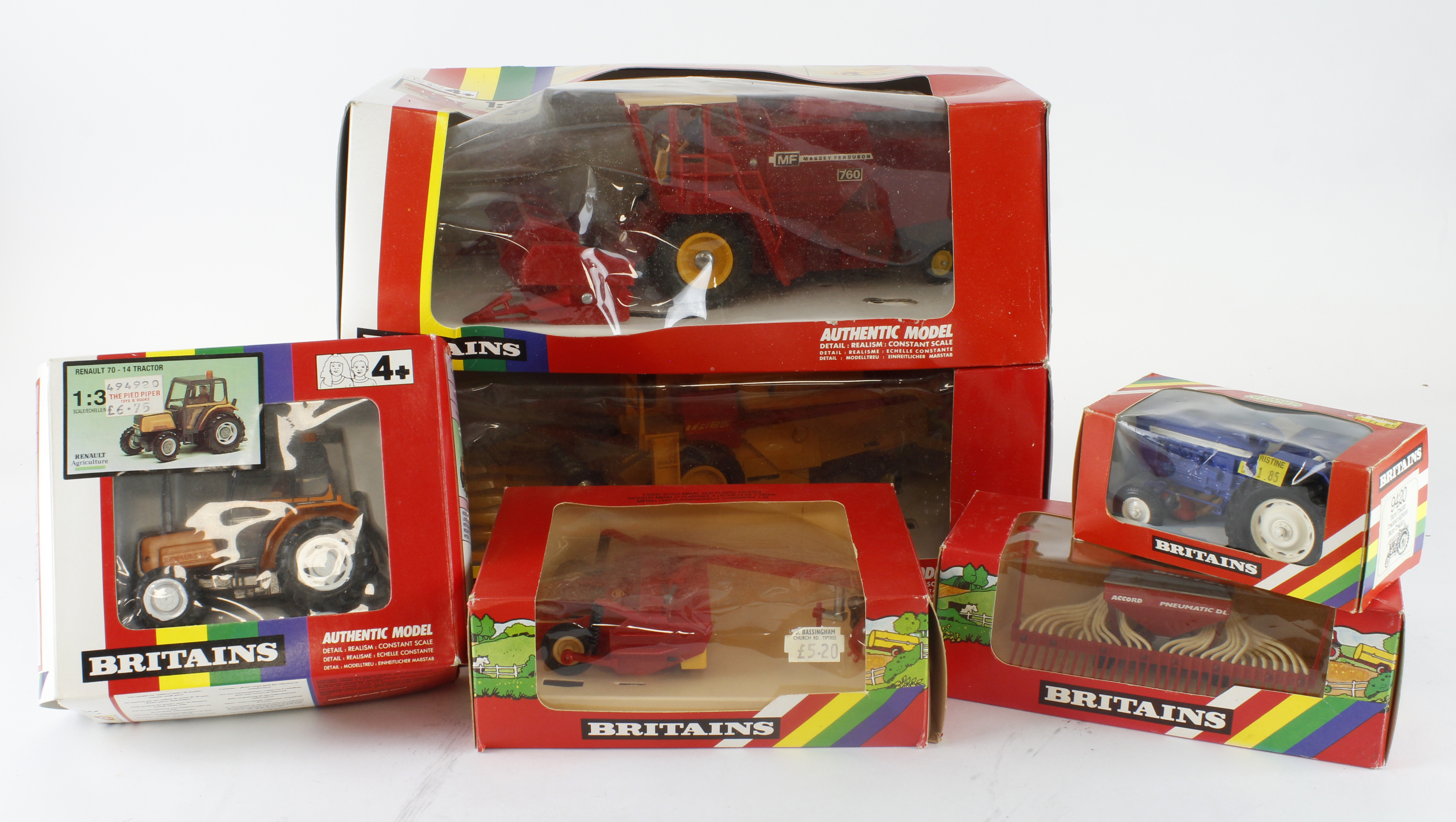 Britains. A group of six boxed Britains (mostly 1:32 scale) farm combine harvesters and accessories,