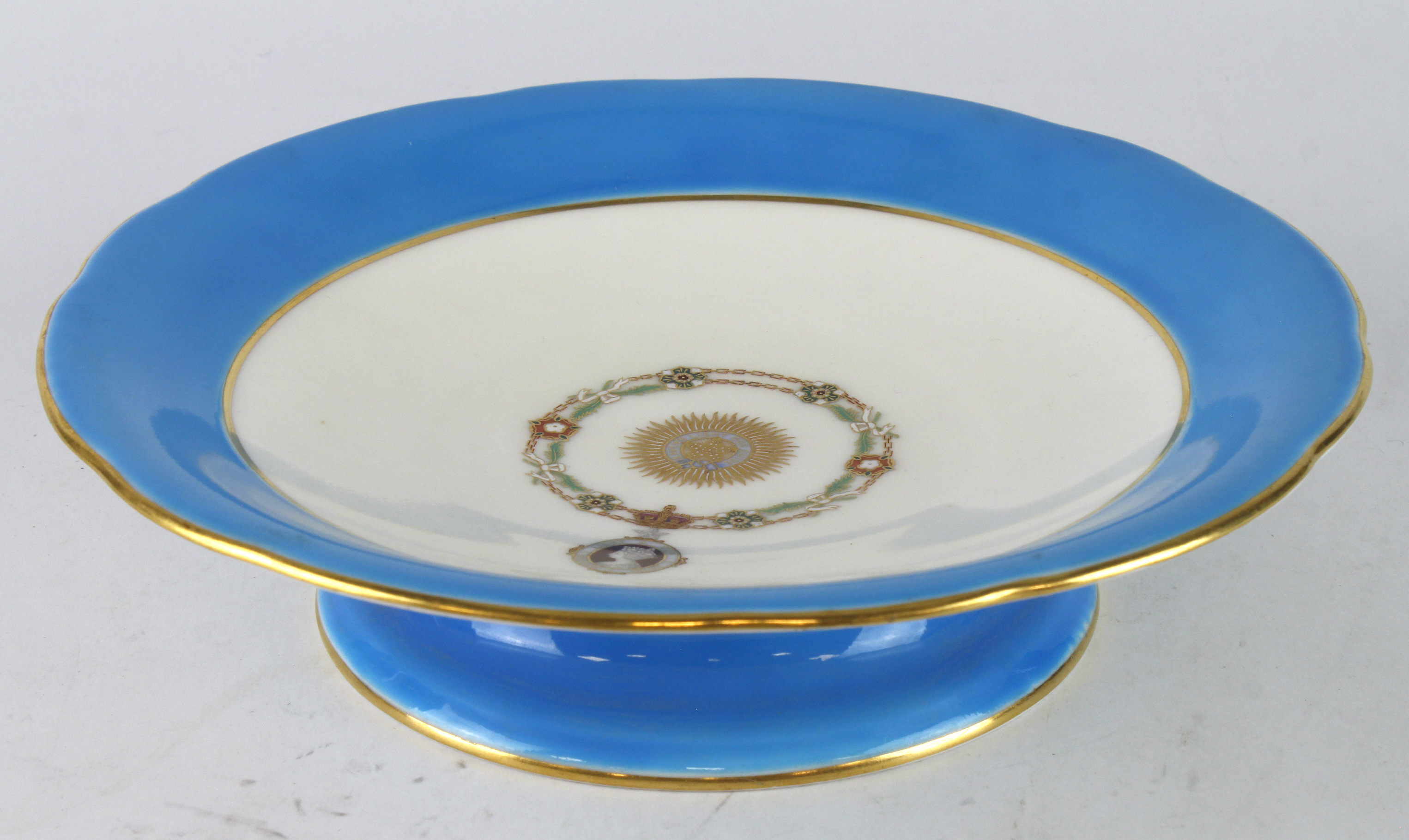 Minton T. Goode & Co. cake stand, decorated with 'Heavens Light Our Guide' emblem to centre,