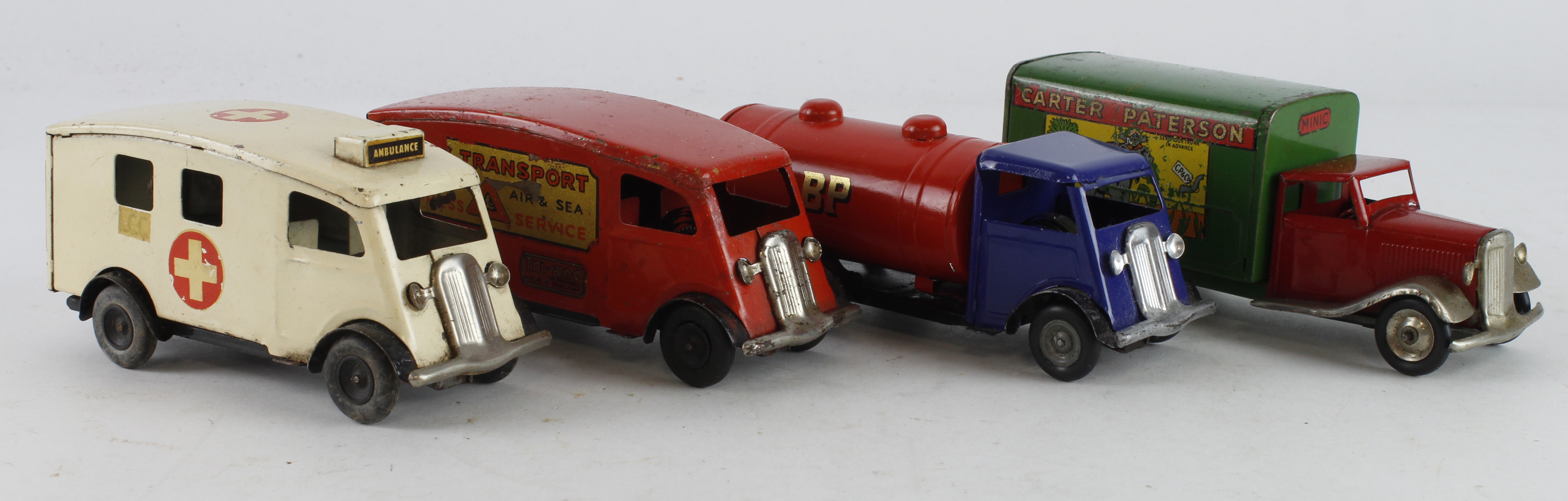 Triang Minic. Four Triang Minic tinplate clockwork lorries and vans, including Carter Paterson,