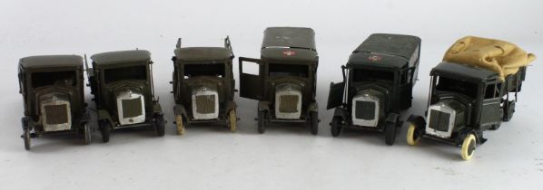 Britains. Six Britains military vehicles, comprising four six wheeled lorries and two Ambulance