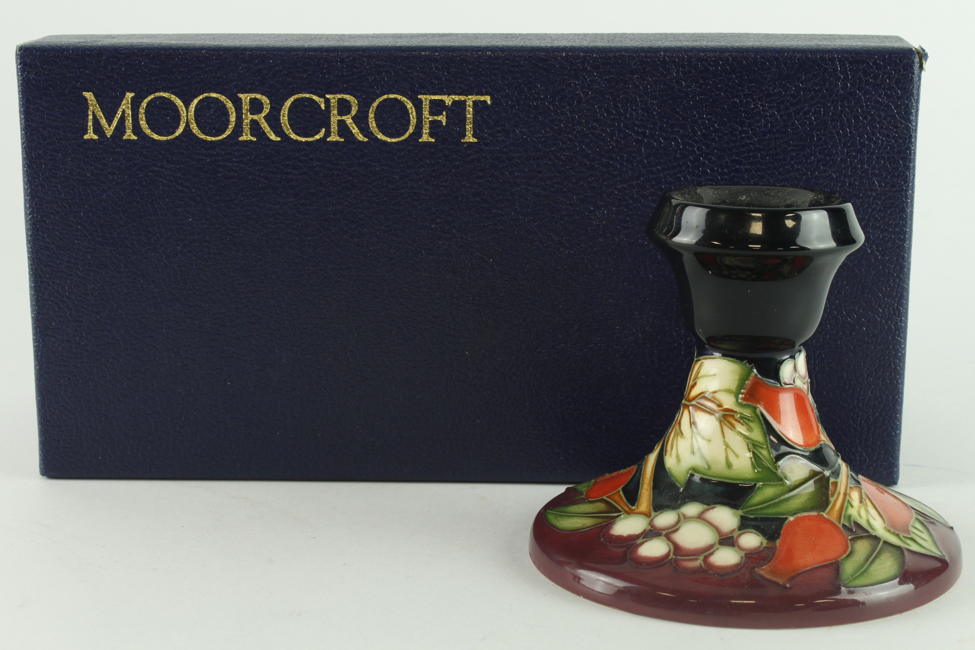 Moorcroft Winter Harvest pattern candlestick holder, makers marks to base, height 8cm approx.