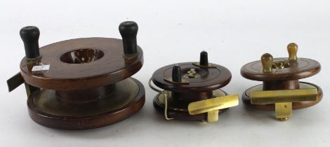Fishing Reels. Three wooden fishing reels with brass mounts, including one stamped 'A. W. Gamage',