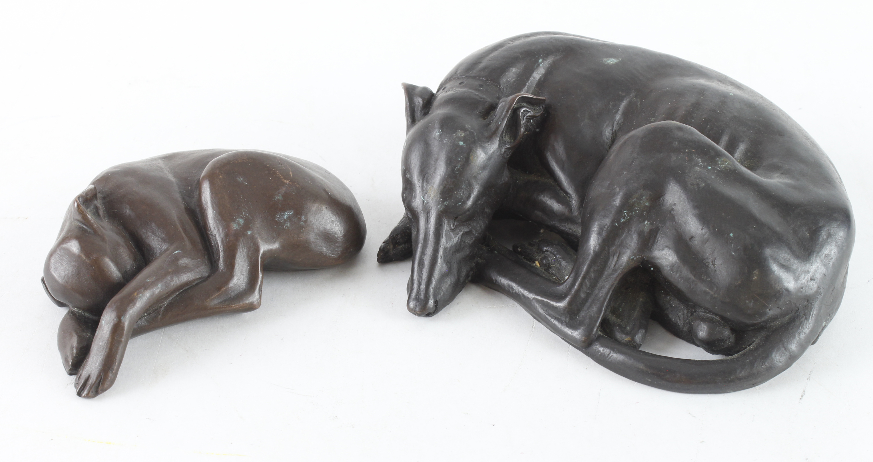 Scaldwell (D. J.). Two bronzed figures depicting sleeping dogs, both signed by artist to base,