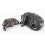 Scaldwell (D. J.). Two bronzed figures depicting sleeping dogs, both signed by artist to base,