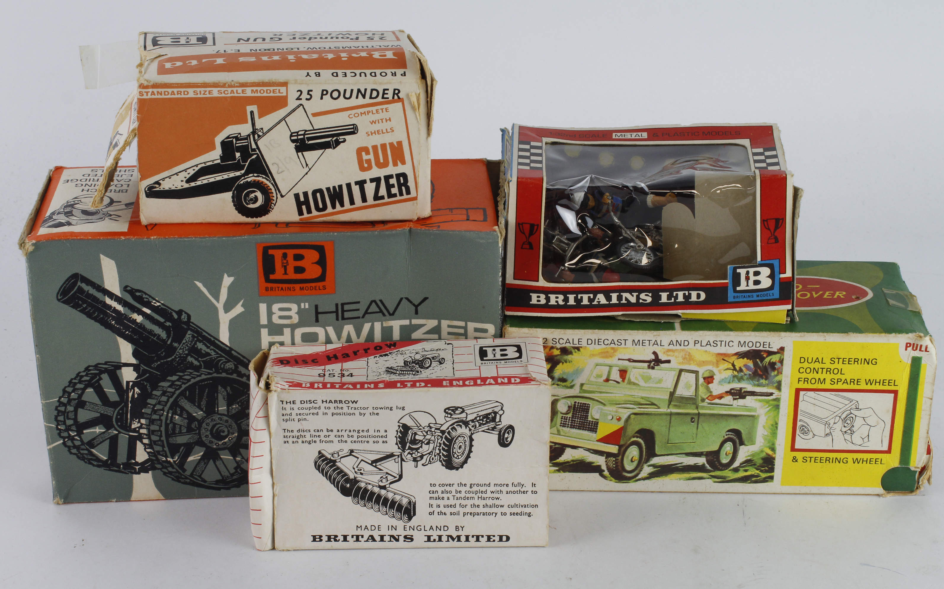 Britains. Five boxed Britains models, including 18" Heavy Howitzer (9740); Military Landrover (