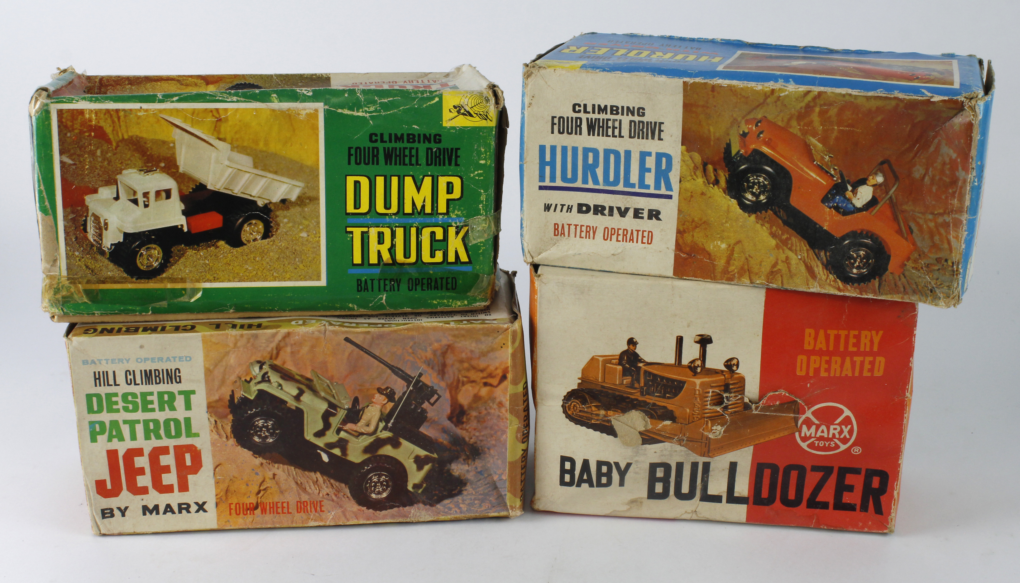 Four boxed battery operated toys, 21 Toy Hurdler; 21 Toy Dump Truck; Marx Baby Bulldozer; Marx