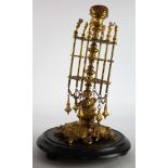 Victorian gilt brass bobbin holder, with ornate decoration on a wooden base, total height 40cm
