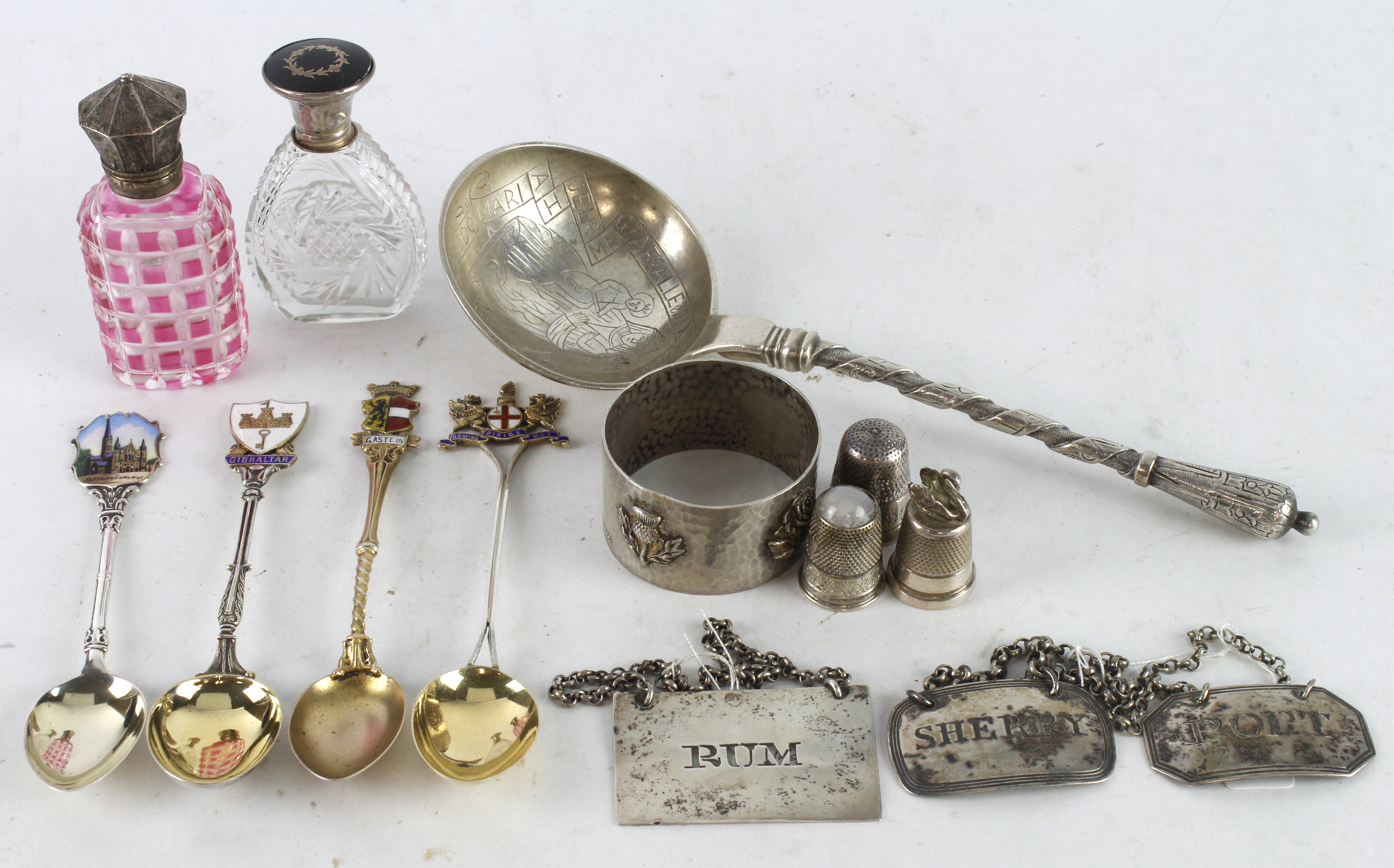 Silver & White Metal. A group of various items including silver teapoons, silver bottle labels,