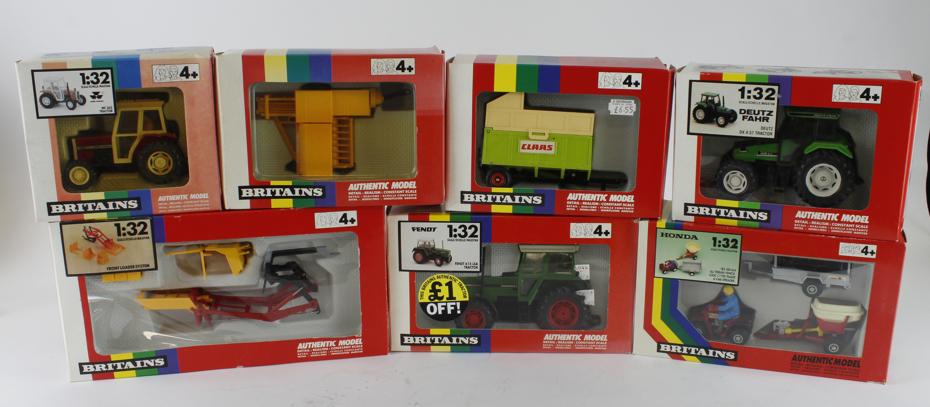 Britains. A group of seven boxed Britains 1:32 scale farm tractors and accessories, comprising 9574,