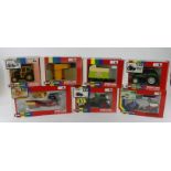 Britains. A group of seven boxed Britains 1:32 scale farm tractors and accessories, comprising 9574,