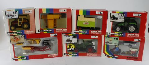 Britains. A group of seven boxed Britains 1:32 scale farm tractors and accessories, comprising 9574,