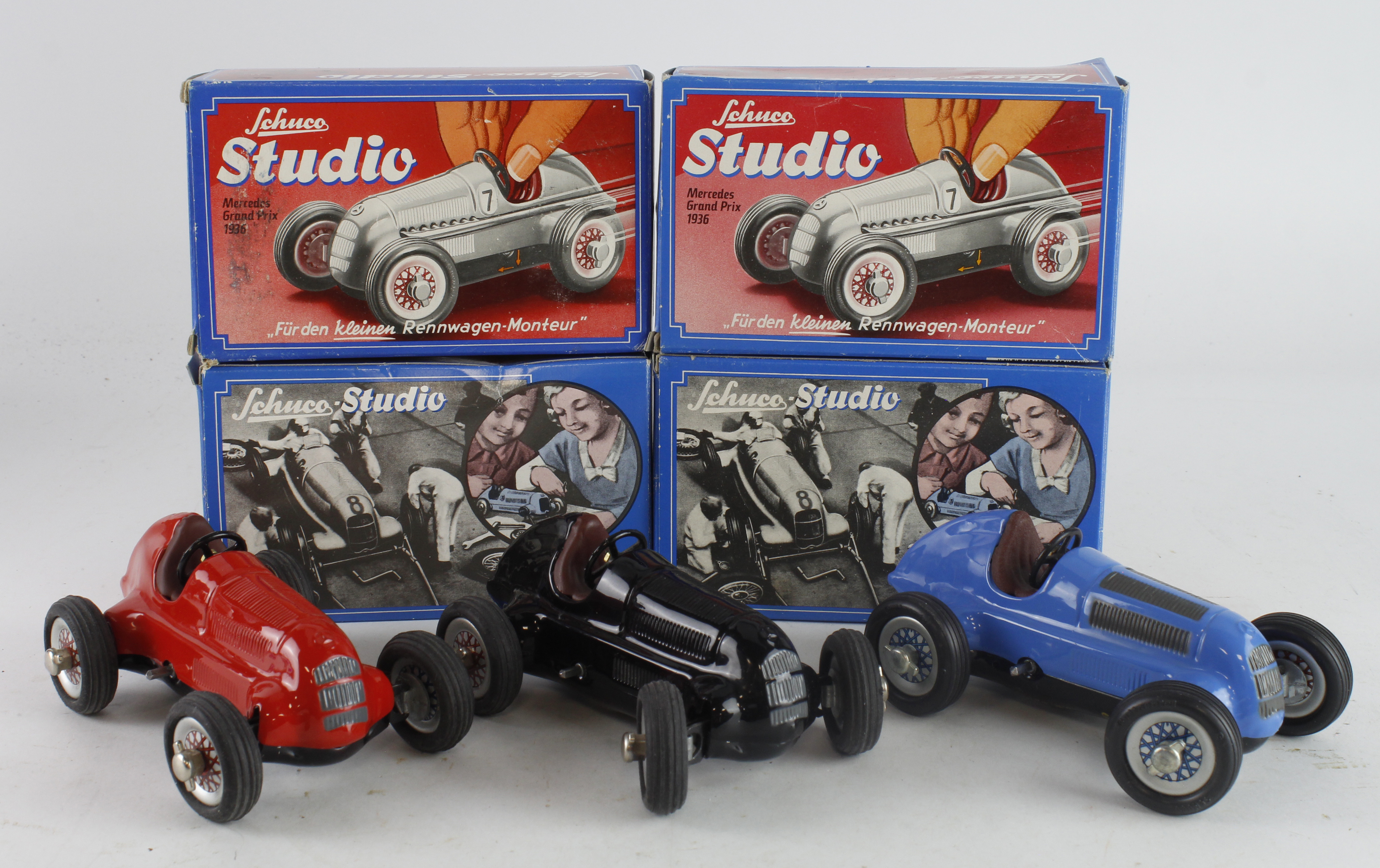 Schuco. Four boxed Schuco Studio racing cars, together with three unboxed
