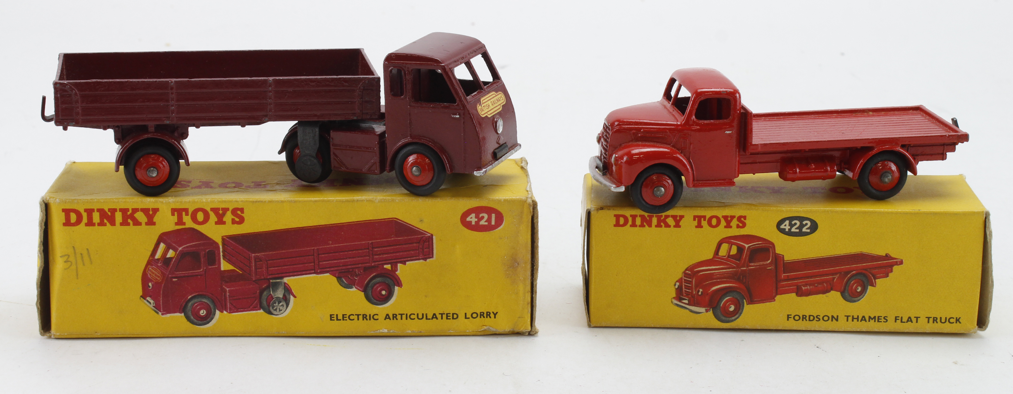 Dinky Toys. Two boxed Dinky models, comprising no. 421 'Electric Articulated Lorry' (red); no.