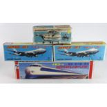 Tinplate. Four boxed Japanese tinplate models, comprising two Friction Powered Jumbo Jet Boeing