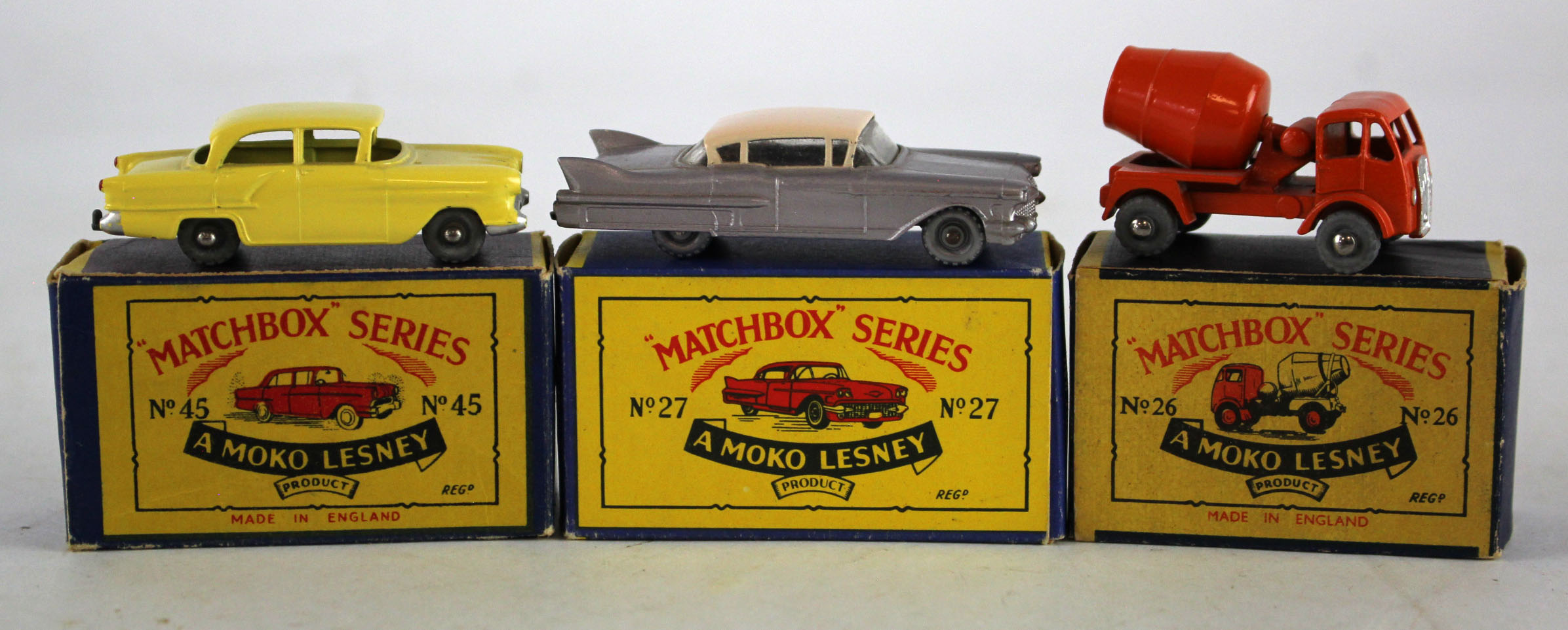 Matchbox. Three boxed Matchbox Moko Lesney models, comprising Concrete Truck (no. 26); Cadillac