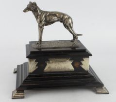 Greyhound interest. A large greyhound art deco trophy with hinged lid, with unengraved plaquest,