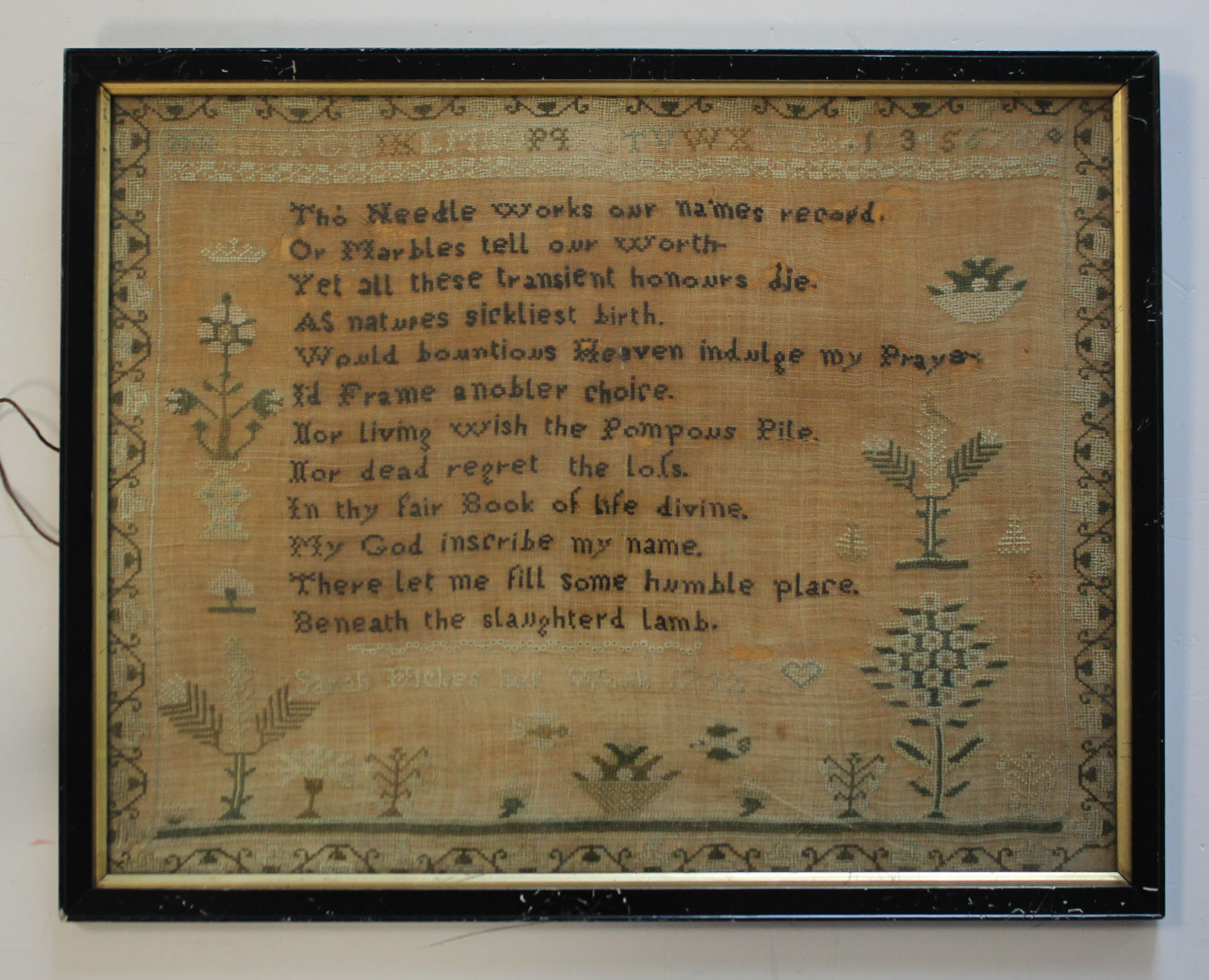 Sampler. A Georgian sampler, by 'Sarah Wickes, 1792', decorated with flowers & trees, framed &