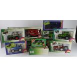 Siku. A collection of eleven boxed Siku 1:32 scale farm tractors, combine harvesters and