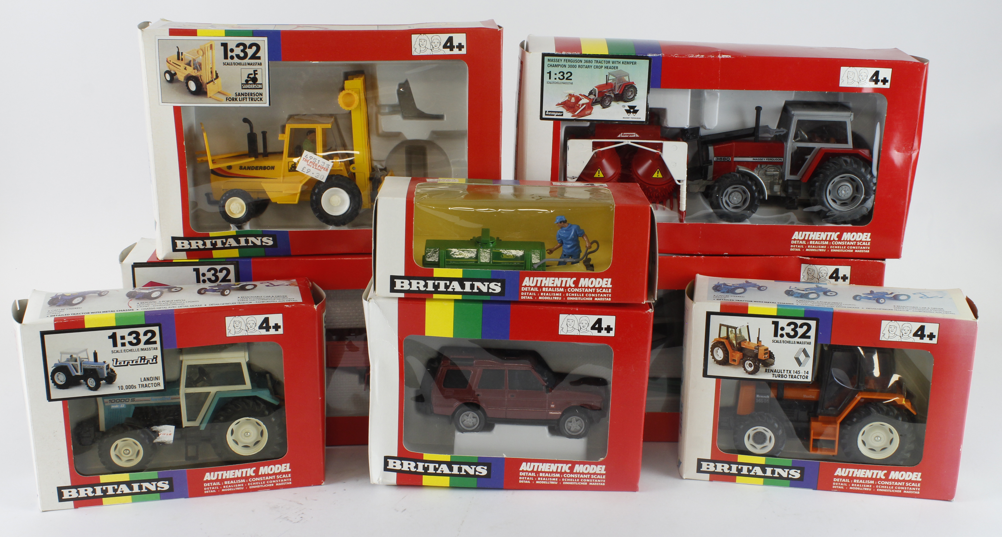 Britains. A group of eight boxed Britains 1:32 scale farm tractors and accessories, comprising 9518,