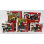 Britains. A group of eight boxed Britains 1:32 scale farm tractors and accessories, comprising 9518,