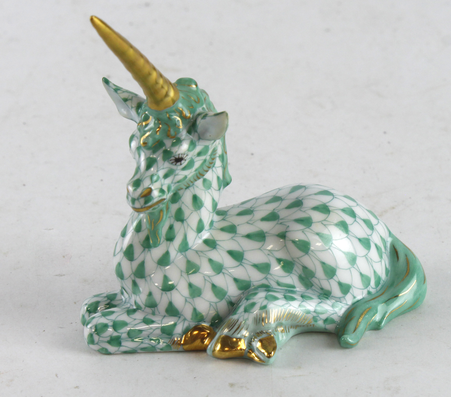 Herend green fishnet unicorn, makers marks to base, height 80mm approx.