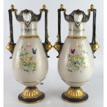 Pair of twin handled vases, with hand painted decoration depicting figures, birds and flowers, circa