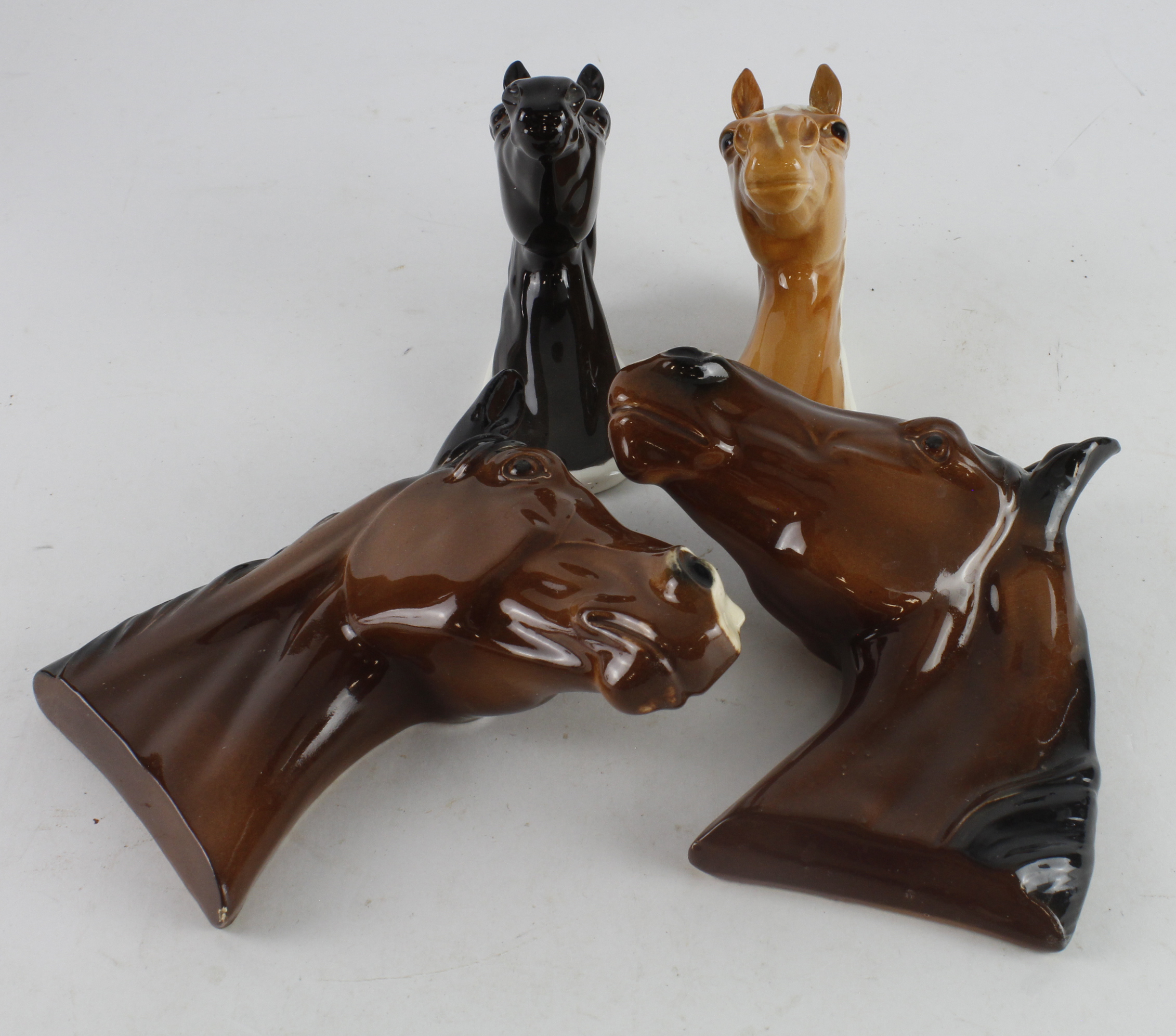 Beswick. Two Beswick horse plaques, comprising Arab (1385) & Palomino (1384), length 11cm,