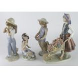 Lladro. Four Lladro figures, comprising a girl pushing a wheel barrow, a Hawaiian girl, and a boy