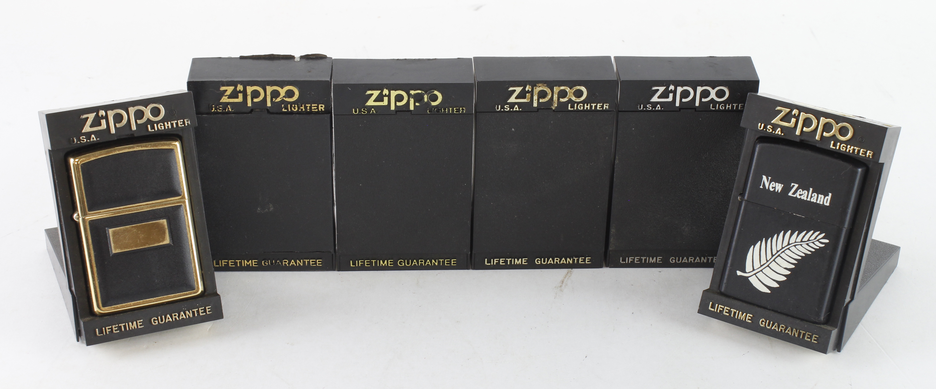 Zippo. Six cased Zippo lighters, including Mercedes, Saudi Arabia, Statue of Liberty, New Zealand,