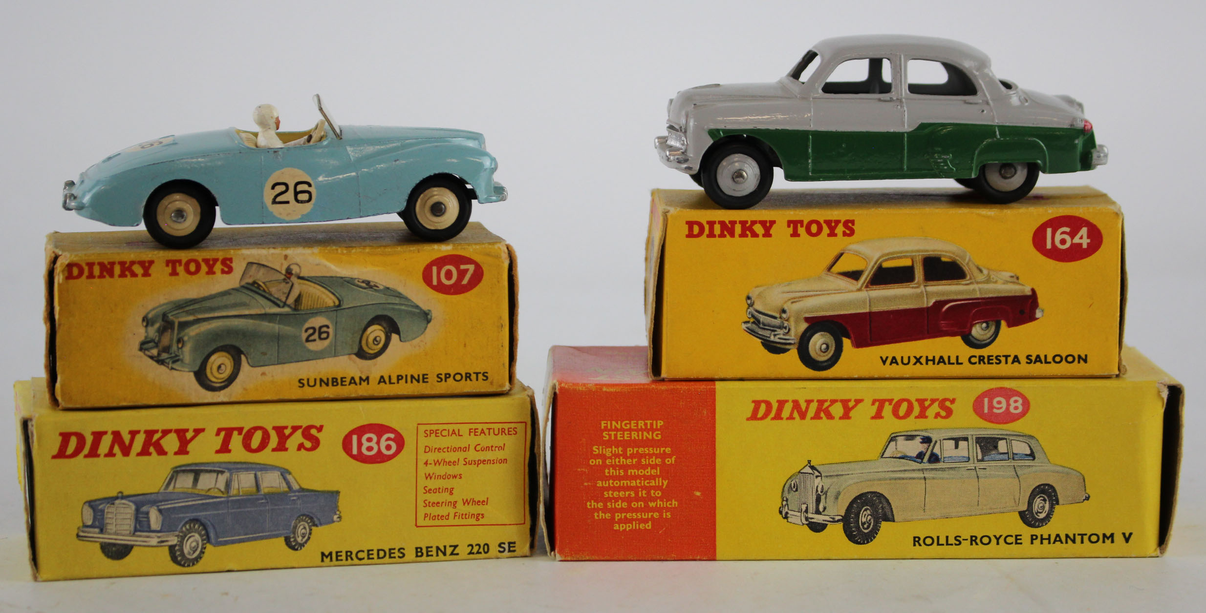 Dinky Toys. Four boxed Dinky models, comprising Rolls Royce Phantom V (no. 198); Mercedes Benz 220