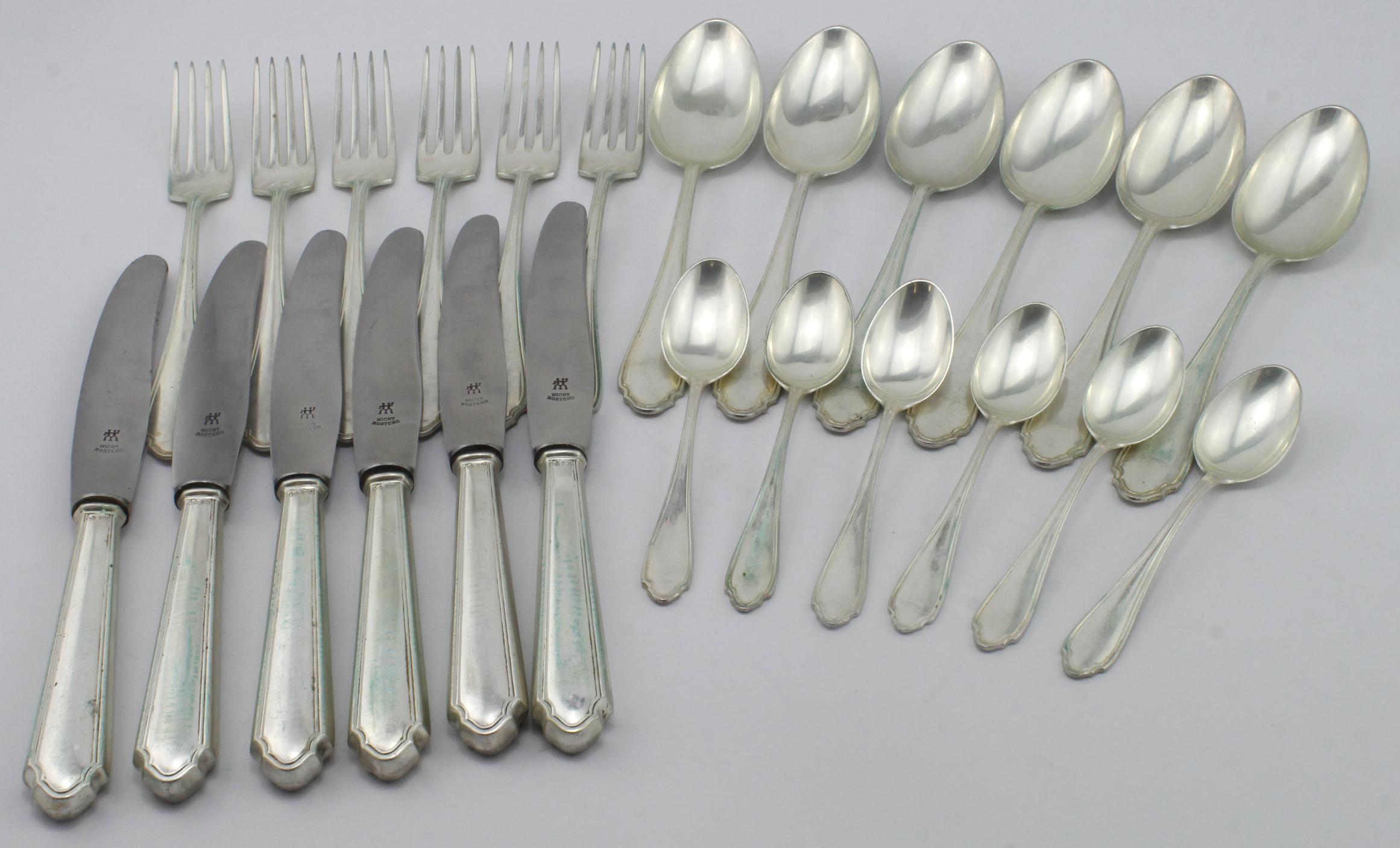 White metal cutlery set, comprising six forks, six knives, six desert spoons & six teaspoons, each