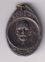 Tobacco issue, Cope's, an oval shaped lead pendant with raised image of footballer Robert