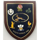 Rugby memorabilia, SA Rugby 1889-1989 larger wooden plaque measuring 9" by 7", featuring Springbok