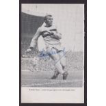 Football autograph, a b/w magazine picture showing Bobby Moore in action for West Ham with bold blue