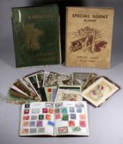 Three stamp albums - UK and world, together with a quantity of early 20th century postcards. (qty)